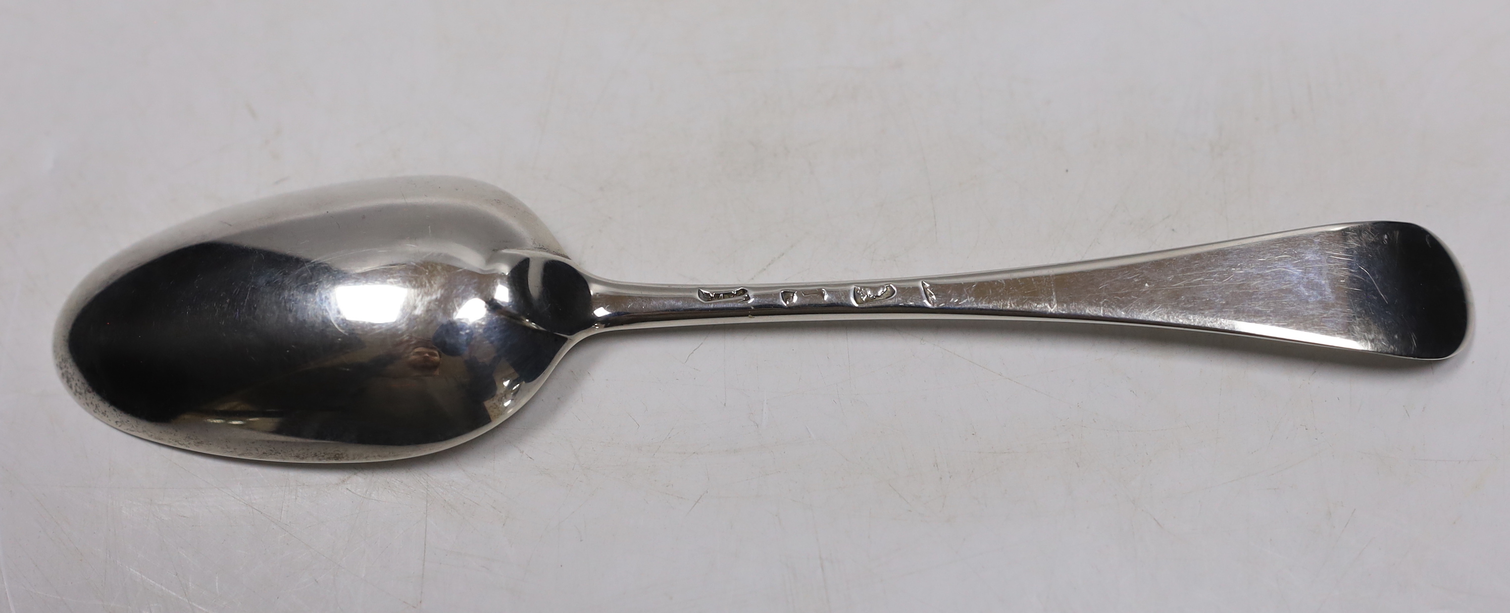 A late George II? bright cut engraved base mark table spoon, marks pinched and rubbed, 20.3cm, 64 grams.